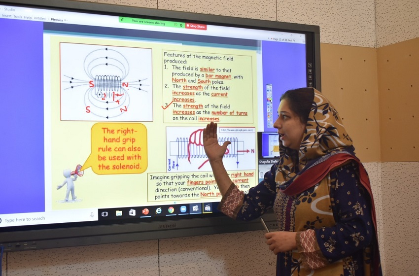 Teacher delivering an OPF e-learning lecture using an interactive digital screen